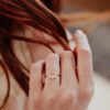 Curved sterling silver band with pear, marquise and baguette-style stones