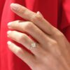 Engagement ring with a cushion-cut stone and pave setting