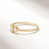 You and Me style ring with balanced baguette and round stone design