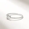 Elegant mixed cut ring featuring a baguette setting and round stone