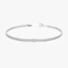 Diamond bracelet featuring a bezel-set CZ stone and Cuban links
