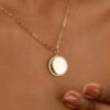 Paperclip chain necklace featuring an 18 mm disc pendant