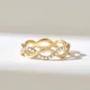 Pave-set Premium CZ Diamond stacking ring in twisted infinity design