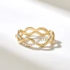 Open twist ring with refined infinity-inspired shape and clean silhouette