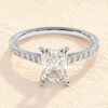 Elongated emerald cut diamond engagement ring with slim band