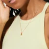 Lipstick necklace featuring a distinctive modern silhouette