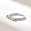 Ribbon-inspired ring with balanced profile and polished finish