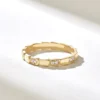 Snake-inspired wedding ring with a slim curved silhouette