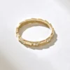 Gold-plated sterling silver snake ring with subtle sparkle