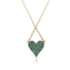 Reversible heart necklace with white CZ diamonds and emeralds