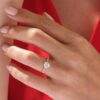 Round cut engagement ring with a detailed pave band