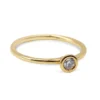 Single diamond bezel ring with minimalist design