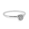 Single diamond bezel ring featuring a bezel-set CZ stone