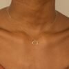 Gold-plated crescent horn necklace with delicate star-like stones