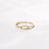 Swarish bezel baguette opal ring with clean modern styling