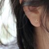 Minimalist diamond leaf stud earrings with a delicate nature-inspired design