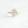 Oval cut engagement ring with halo and threaded band detail