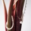 Pendant with distinctive link-inspired pattern and polished finish