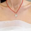 Elegant bond pendant necklace with coral beads and polished finish