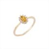 Oval citrine ring with round diamond accents and bezel setting