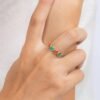 Bezel-set round coral and turquoise stones in an eternity band