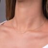 Modern curved bar necklace with prong-set stones