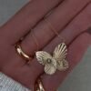 Butterfly-inspired necklace with a delicate burst love design