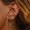 Butterfly burst stud earrings featuring premium CZ diamond accents