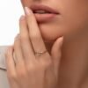 Initial H ring with thick gold plating and prong-set stones