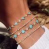 Elegant bracelet with balanced round bezel sections along the chain