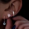 Moonstone stud earrings featuring premium CZ diamond accents and a minimal shape