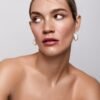 Pearl drop earrings with thick gold plating and classic detailing