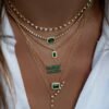 Sterling silver necklace featuring emerald and diamond accents