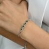 Slim emerald and diamond-inspired bracelet designed with pear-shaped accents