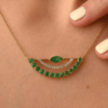 Pendant necklace with prong and pave-set emerald and diamond details