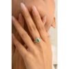 925 sterling silver ring with halo-set emerald and diamonds