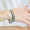925 sterling silver bracelet with prong-set CZ emerald and diamond stones