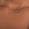 Gold-plated sterling silver necklace with a streamlined bar design
