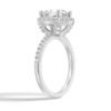 Classic engagement ring featuring pavé shoulders and halo