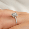 Four-prong pavé halo ring with elegant graduated band