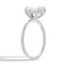 Engagement ring highlighting a pear cut profile and accent sparkle