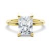 Engagement ring featuring a prong-set radiant cut stone and hidden halo