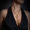 Statement necklace with draped links and polished thick gold plating
