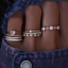 Half eternity ring with a refined baguette diamond-style setting
