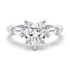 Heart-shaped sterling silver engagement ring with tapered baguette stones