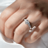 Elegant heart-shaped ring with tapered baguette side stones and refined lines