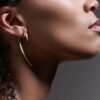 Large hook earrings with thick gold plating and smooth finish