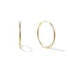 Minimalist sterling silver hoop earrings with a smooth round tube profile