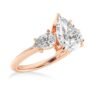Pear shaped ring with a balanced three stone design