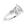 Three stone engagement ring with a graceful pear cut centre